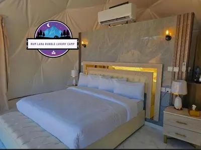 a bedroom with a bed and a sign that reads not end radiator winter cry at RUM LARA BUBBLES lUXURY CAMP in Wadi Rum