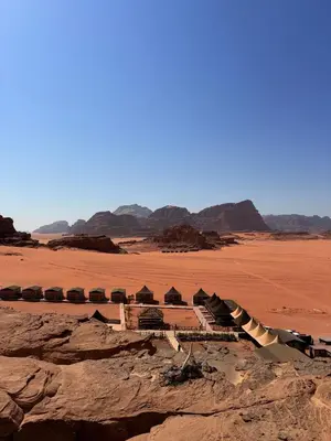 a building in the middle of the desert at Luxury Camp Wadi Rum in Disah