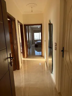 a hallway leading to a living room with a hallway at شقة للإيجار في عجلون in Ajloun