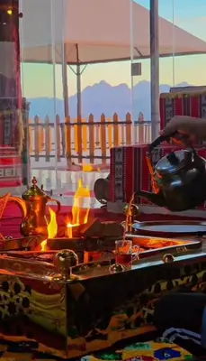a pot on a stove with a fire in a room at LONAR LORE lUXURY CAMP in Disah