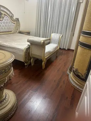 a bedroom with a bed and a chair at Rasheed pearl in Amman
