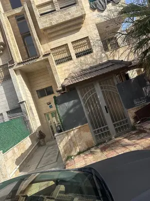a house with a gate on the front of it at Rasheed pearl in Amman