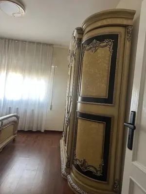 a door to a room with a bed in it at Rasheed pearl in Amman