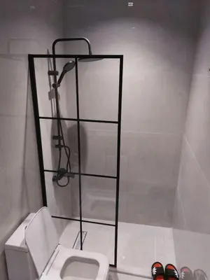 a bathroom with a toilet and a glass shelf at رياحين الخلود in Amman