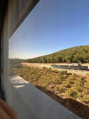 a view of a road from a train window at Bait Ajloun in Khirbat Shīn