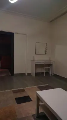 a white room with a table and a desk at home 7 in Amman