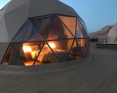 a tent with a fire inside of it at Teraa rum luxury camp in Wadi Rum
