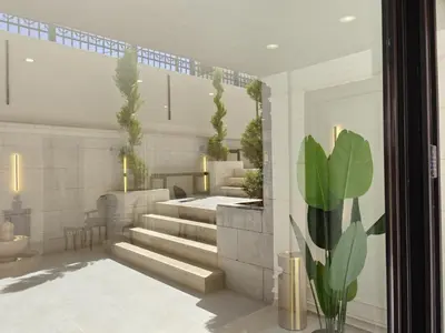 a lobby with stairs and plants in a building at ذا سهل ستيز in Amman