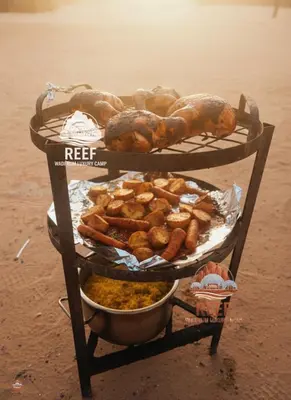 a stand with different types of bread and pastries at Reef Rum Luxury Camp in Disah