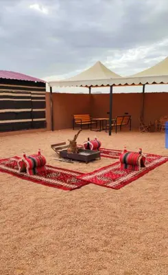 a tent with two animals laying on the ground at Fortuna Rum Bubble Hotel & Jeep Tours in Wadi Rum