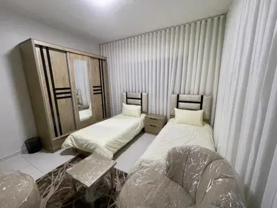 a room with two beds and a window at jordanien madaba in Madaba