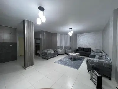 a living room with a couch and a table at apartement khaled in Madaba