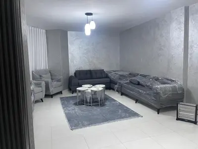 a living room with a bed and a couch at apartement khaled in Madaba