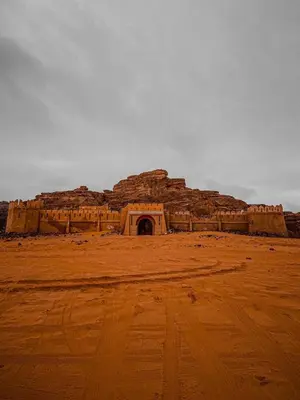 an old building in the middle of a desert at Desert Glow Wadi Rum in Wadi Rum