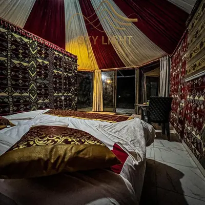 a bedroom with a bed in a tent at Skylight Wadi Rum Camp in Disah