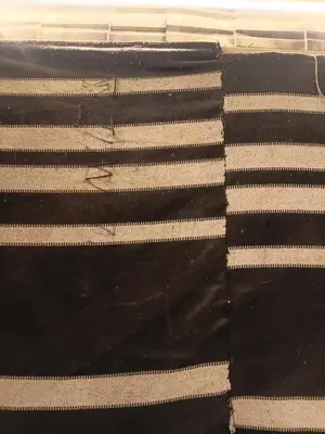 a black and white rug with white stripes at Rum Towers Luxury Camp in Aqaba