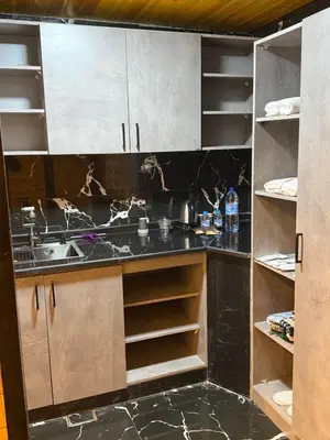 a kitchen with a sink and a counter at Akwakh Al-Kanz اكواخ الكنز عجلون in Ajloun