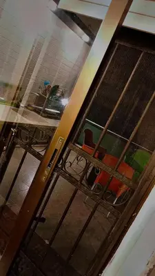 an open door to a room with a table and chairs at شقه مفروشه بالكامل مكونه من 4 غرف في ضاحيه الأمير راشد عمان شارع مكه in Amman