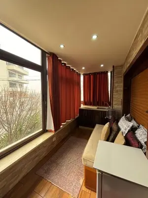 a living room with a couch and a large window at فيلا مميزة في عمان - Special Villa in Amman in Amman