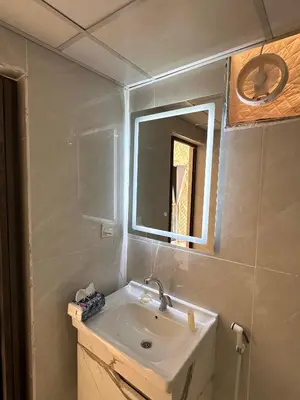 a bathroom with a sink and a mirror at Wadi Rum Nada Camp in Wadi Rum