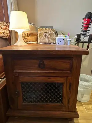 a wooden table with a lamp on top of it at In Balm Society ضاحية النخيل BR 3 Super Deluxe in Amman