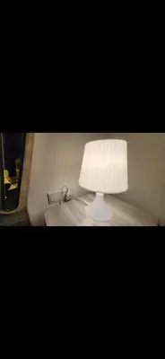 a white lamp sitting on top of a table at Qqq2 in Amman