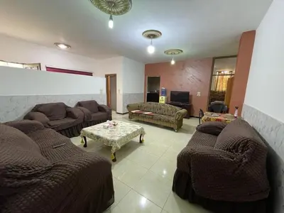 a living room with a couch and a table at Jerash Skyline in Jerash