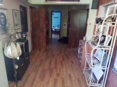 a hallway with a hard wood floor and a room at Petra Neighbor Hostel in Wadi Musa