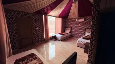 a room with two beds and a purple ceiling at Hello Desert Camp & Tour