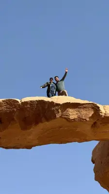 two people are standing on top of a rock at Monte Carlos Luxury Camp in Disah