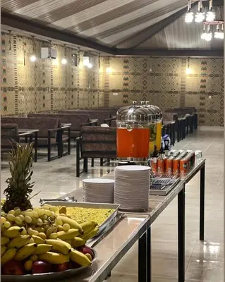a table with fruit and a juicer on top of it at Monte Carlos Luxury Camp in Disah