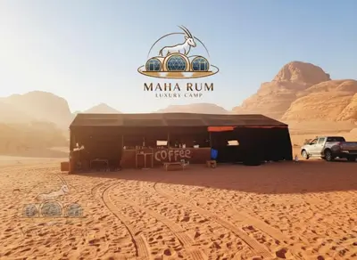 a building in the middle of the desert at MAHA Rum Luxury Camp in Disah