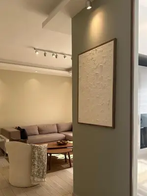 a living room with a couch and a table at 24h security, family friendly remodeled cozy space in Amman