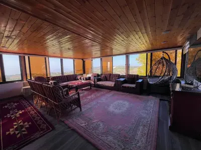 an aerial view of a living room with couches and chairs at Um Al Namel Villa & Chalet