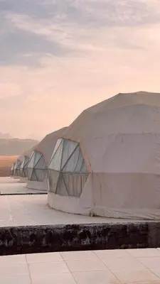 two large white tents sitting in a field at Yazeed in Disah