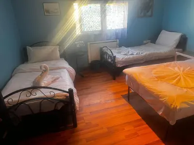 a bedroom with two twin beds and a window at Petra Neighbor Hostel in Petra