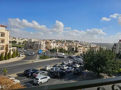 a bunch of cars parked in a parking lot at شقة فاخرة في دير غبار in Amman