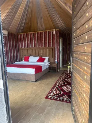 a bedroom with a bed in a tent at The Red Rock Camp in Wadi Rum