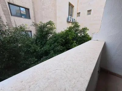a ledge of a building next to a building at 220 sqm 3 BR Um Al Summag, Makka Street