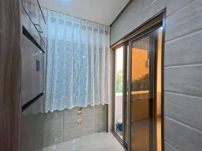 a hallway with a glass door and a window at 220 sqm 3 BR Um Al Summag, Makka Street