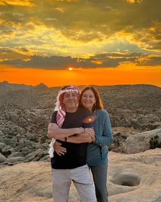 a man and woman standing on top of a mountain at Dana Trail Nomad Camp in Dana
