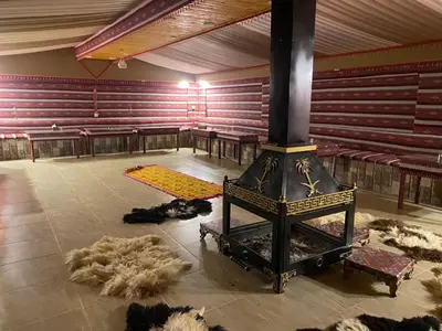a large room with a stove in the middle at Star Desert Camp in Wadi Rum