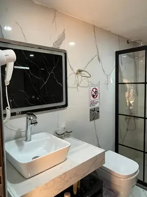 a bathroom with a sink and a toilet at Imperial Rum Luxury Camp in Wadi Rum