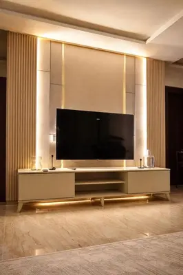 a living room with a large flat screen tv at Der Ghbar 3BR - 2 Terraces, Scenic Views & BBQ in Amman