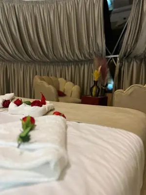 a hotel room with two beds with roses on them at Rina Luxury Camp in Disah