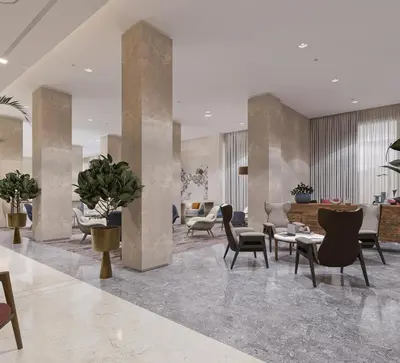 a lobby with chairs and tables in a building at Crowne Plaza Resort Petra by IHG in Wadi Musa
