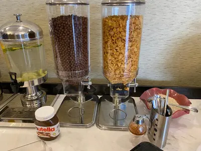 two blenders filled with food sitting on a counter at Nishan Hotel in Amman