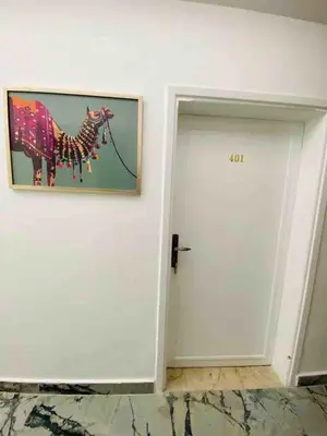 a door with a picture of a camel on the wall at Zaman Ya Zaman Boutique Hotel in Amman
