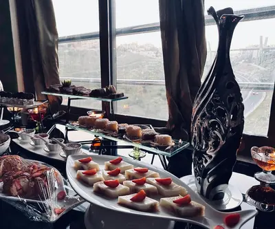 a buffet of food on a table with a plate of food at Olive Hotel Amman in Amman