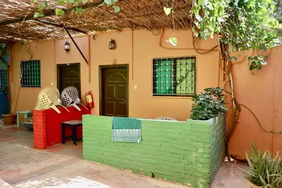 a house with a colorful fence in front of it at Bedouin Garden Village, hotel Dive in Aqaba